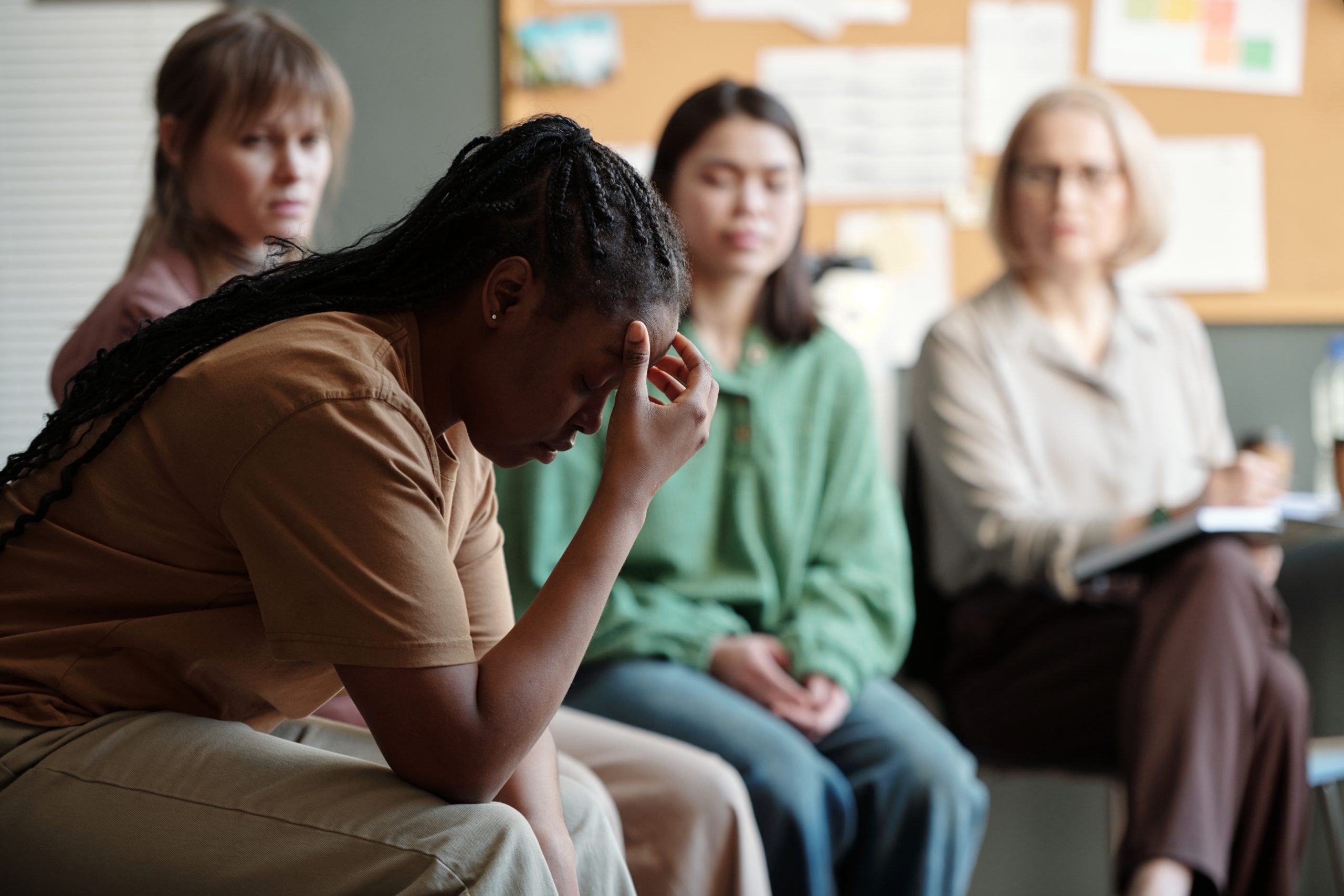 Side,View,Of,Desperate,African,American,Woman,Touching,Head,And