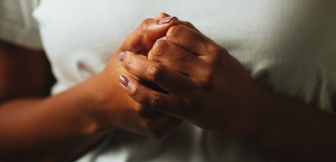 A picture of a woman's hands clasped together